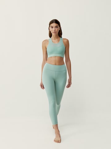 Skinny Pantalon de sport 'Daya' Born Living Yoga en vert