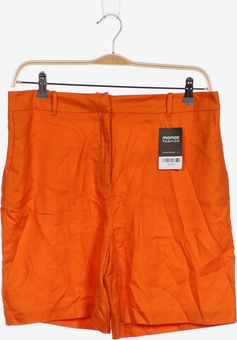 Reserved Shorts in XL in Orange: front