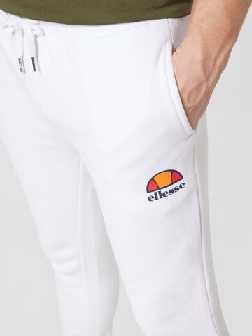 ELLESSE Конический (Tapered) Спортивные штаны 'Ovest' в Белый