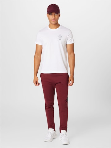 Tapered Pantaloni di WESTMARK LONDON in rosso