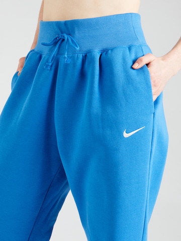 Nike Sportswear Tapered Broek 'Phoenix Fleece' in Blauw