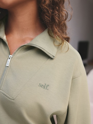 Felpa di self. in verde