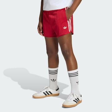 ADIDAS ORIGINALS Loose fit Trousers in Red: front