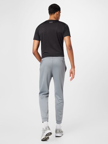 Effilé Pantalon de sport 'Tenacity' new balance en gris