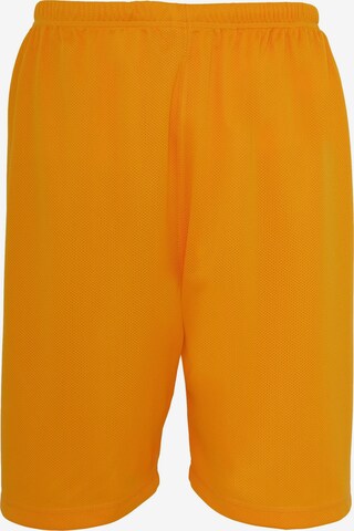 Pantalon Urban Classics en orange : devant