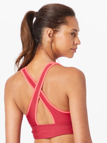 UNDER ARMOUR Medium Support Sports Bra 'Armour Mid' in Pink