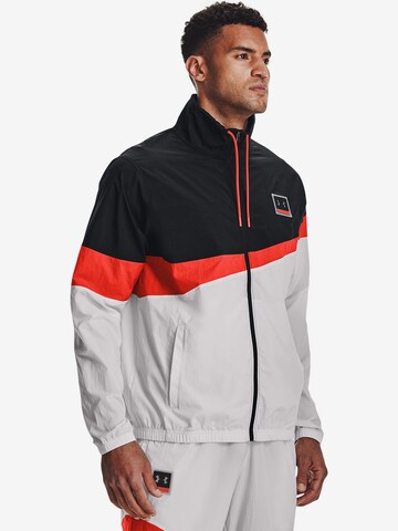 UNDER ARMOUR - Chaqueta de chándal en gris