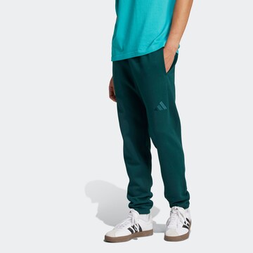 ADIDAS SPORTSWEAR Tapered Sporthose in Grün