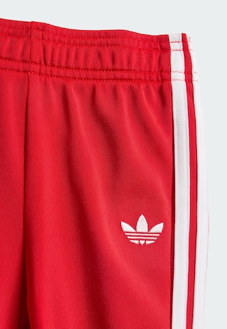 ADIDAS ORIGINALS Joggingpak 'Sst' in Rood