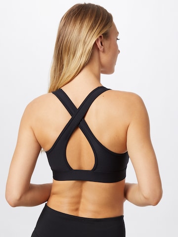 Bustino Reggiseno sportivo di UNDER ARMOUR in nero