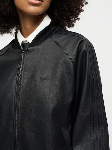 ADIDAS ORIGINALS Преходно яке 'SST' в черно