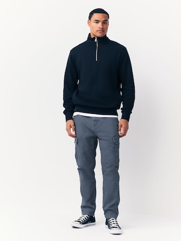 Next Slimfit Gargohousut värissä sininen