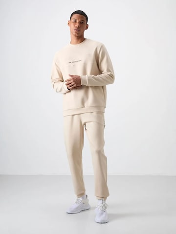 Tuta da jogging di Tommy Life in beige