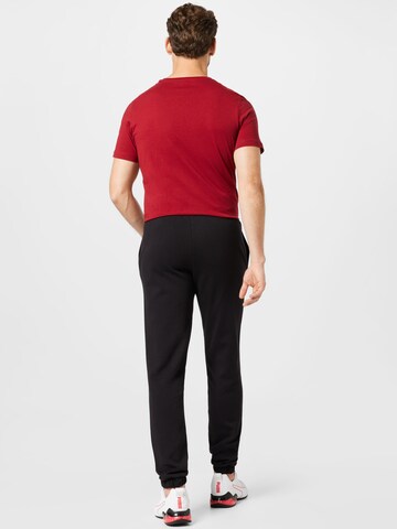 Effilé Pantalon de sport PUMA en noir