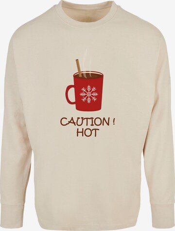 T-Shirt 'Caution Hot' Merchcode en beige : devant