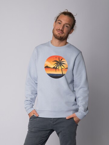 Felpa ' Sunset on palm beach ' di Watapparel in blu: frontale