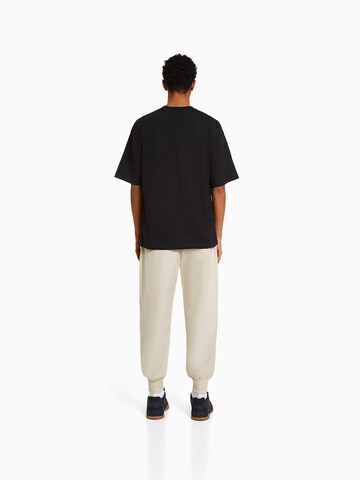 Bershka Tapered Cargo Pants in Beige