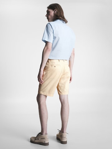 TOMMY HILFIGER Regular Chino trousers 'Harlem' in Yellow