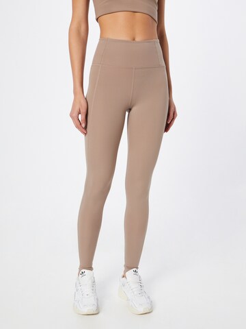 Girlfriend Collective Skinny Workout Pants in Brown: front