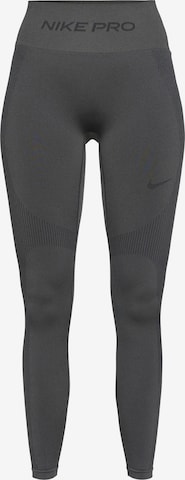 Skinny Pantaloni sport de la NIKE pe gri: față