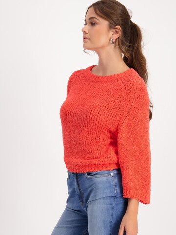 Pullover di monari in arancione