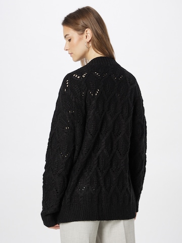 ABOUT YOU Knit Cardigan 'Goldie' in Black