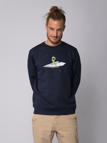 Watapparel Sweatshirt ' Alien on a paper plane ' in Blau: Vorderseite