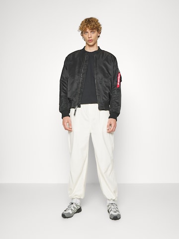 ALPHA INDUSTRIES - Casaco meia-estação 'Dragon' em preto
