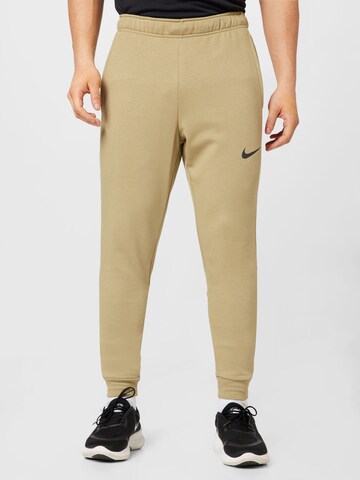 Tapered Pantaloni sportivi di NIKE in beige: frontale