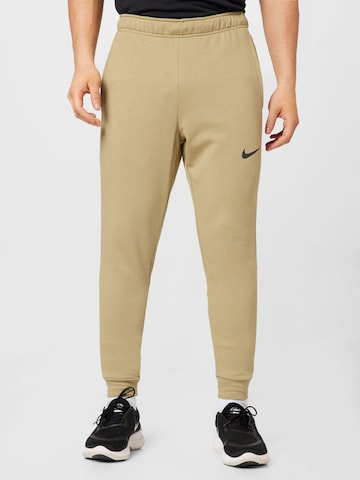 NIKE Tapered Workout Pants in Beige: front