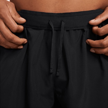 NIKE Regular Workout Pants in Black