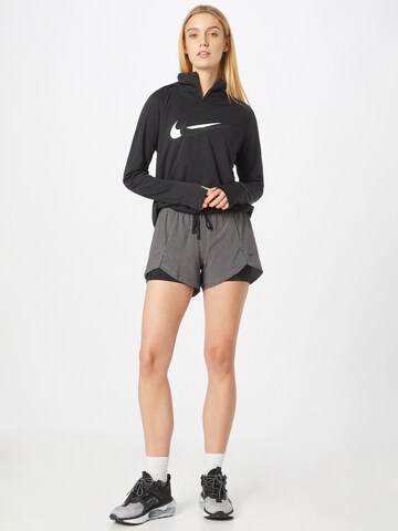 NIKE - Regular Calças de desporto em cinzento