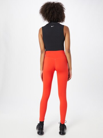 Skinny Pantalon de sport NIKE en rouge