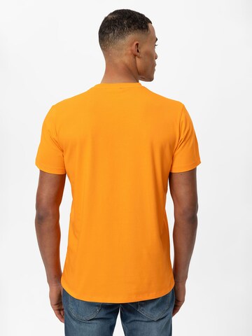 Tricou de la Daniel Hills pe portocaliu