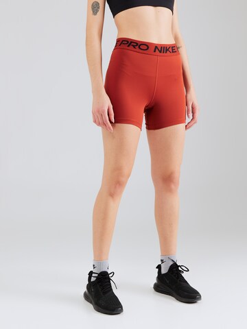 NIKE Skinny Sportbroek 'Pro 365' in Oranje: voorkant