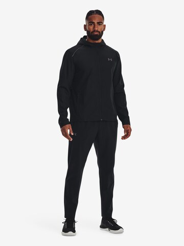 Effilé Pantalon de sport UNDER ARMOUR en noir