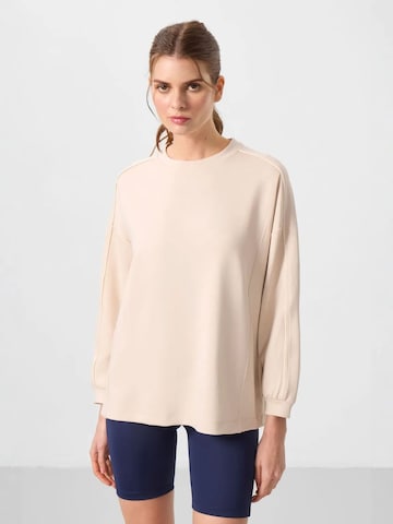 Tommy Life Top w kolorze beżowy: przód