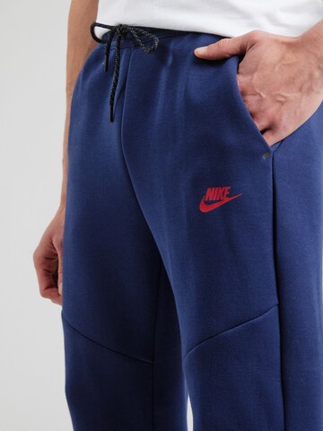 Effilé Pantalon 'TCH FLC' Nike Sportswear en bleu