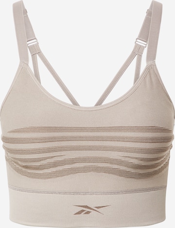 Reebok - Bustier Sujetador deportivo en beige: frente