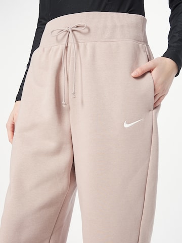 smėlio Nike Sportswear Siaurėjantis Kelnės 'Phoenix Fleece'