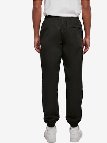 Tapered Pantaloni di Urban Classics in nero