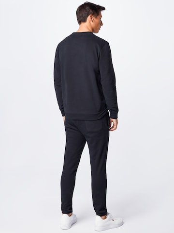 BOSS Orange Tapered Broek 'Skeefast' in Zwart