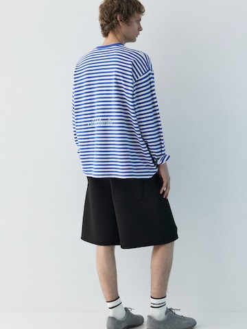 Pull&BearBaggy Hlače - crna boja