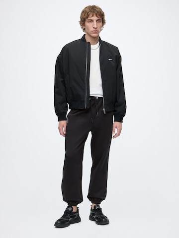 KARL LAGERFELD JEANS Tapered Housut värissä musta