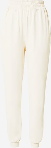 HKMX - Tapered Pantalón deportivo 'Flow' en beige: frente