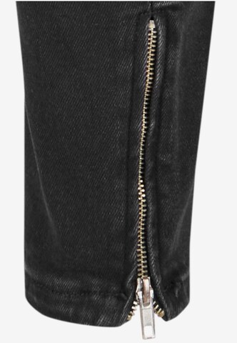 Skinny Jeans di Karl Kani in nero