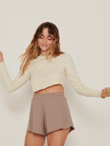 ABOUT YOU x Sofia Tsakiridou Wide leg Pants 'Holly' in Brown