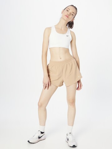 regular Pantaloni sportivi di NIKE in beige