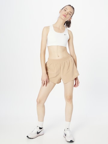 NIKE Regular Workout Pants in Beige