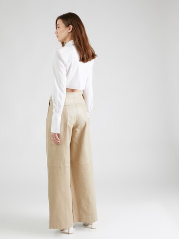 REMAIN Wide Leg Housut värissä beige